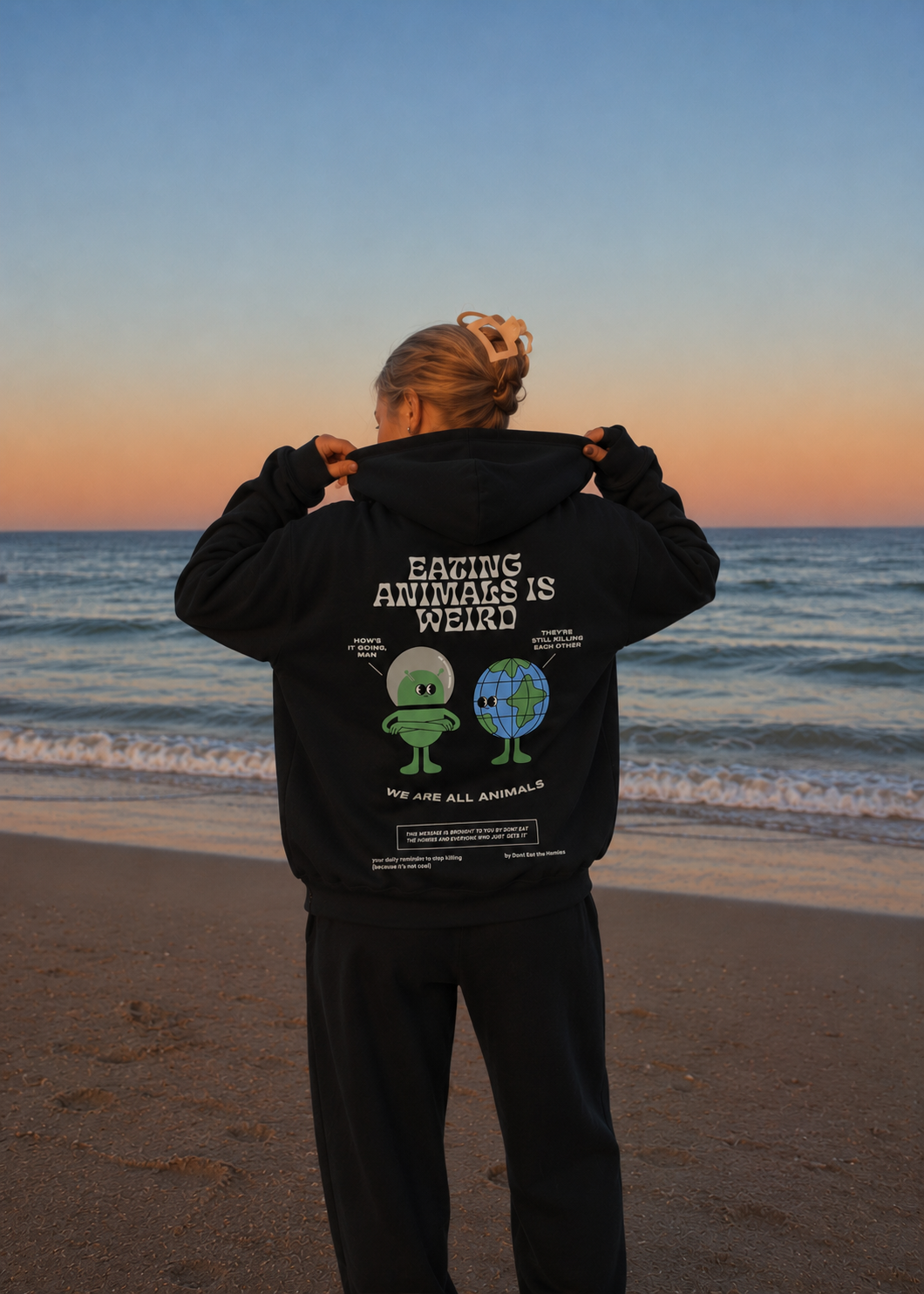 EATING ANIMALS IS WEIRD HOODIE